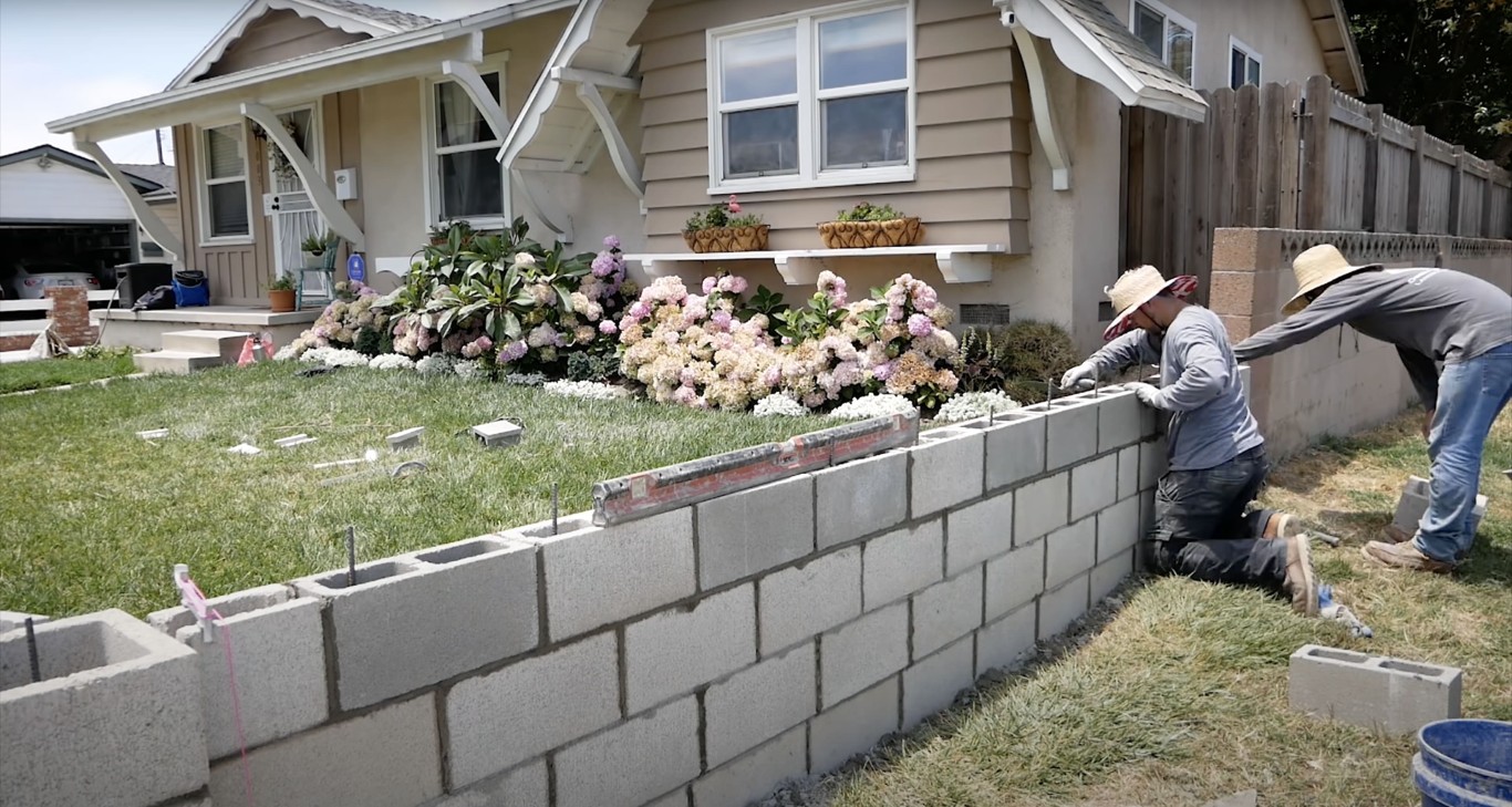 Concrete block retaining wall construction