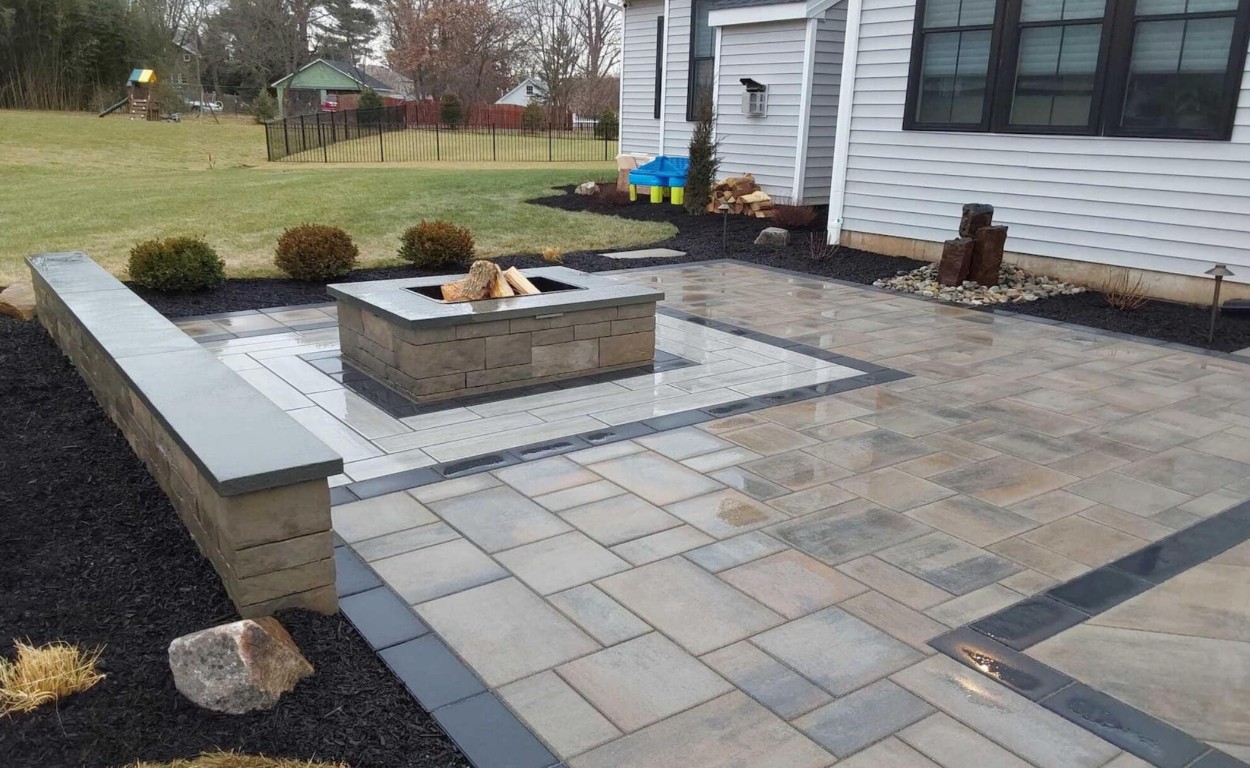 Beautiful decorative concrete patio with custom fire pit