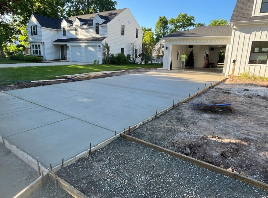 Fresh concrete driveway pour showing proper base preparation