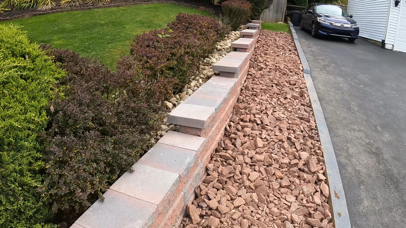 Concrete retaining wall and steps showcasing quality craftsmanship